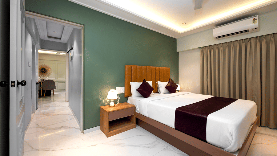 Contemporary king bedroom with premium amenities at Home2 Residency, Mumbai Airport