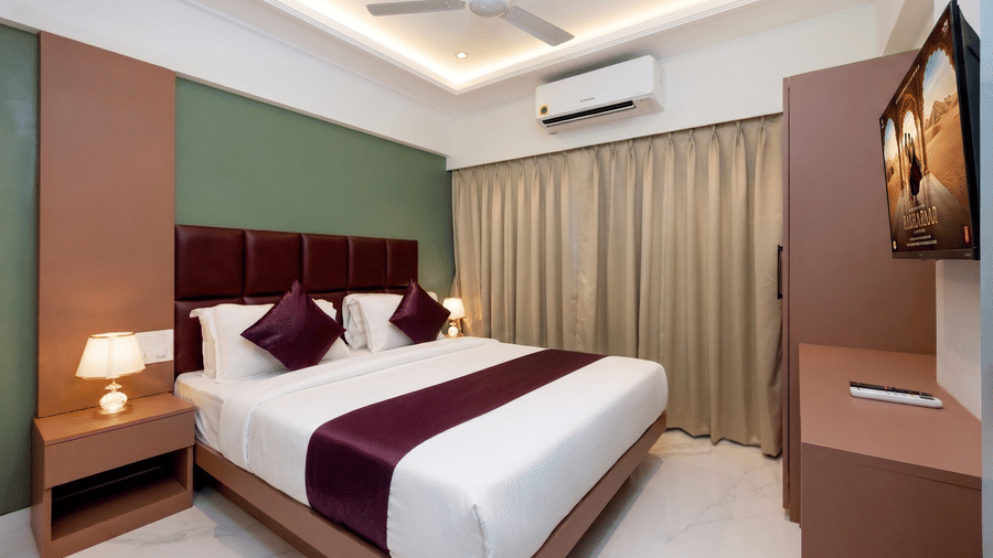 Comfortable king bedroom with modern interiors at Home2 Residency, Mumbai Airport