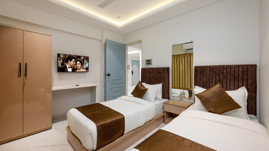 Twin bedroom with modern interiors at Home2 Residency, Mumbai Airport