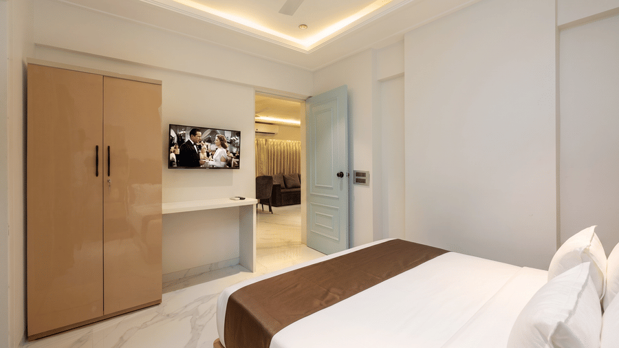 Modern bedroom with wardrobe at Home2 Residency, Mumbai Airport