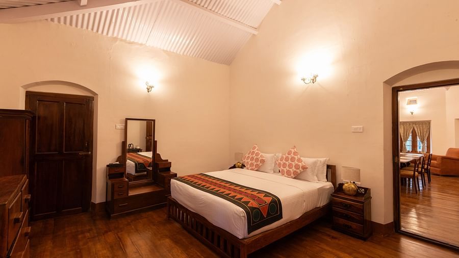 The Whitehall room with a king size bed, a dressing table along with other amenities - Ibex Stays & Trails, Coonoor (Leewood).