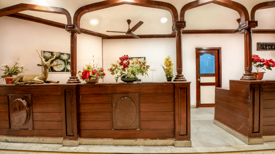 Elegant reception area at Jayaram Hotel, Pondicherry with a welcoming front desk and warm interiors for a pleasant arrival experience.