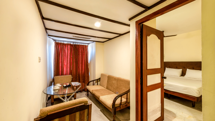 Spacious suite at Jayaram Hotel, Pondicherry with separate living and sleeping areas for a comfortable stay.