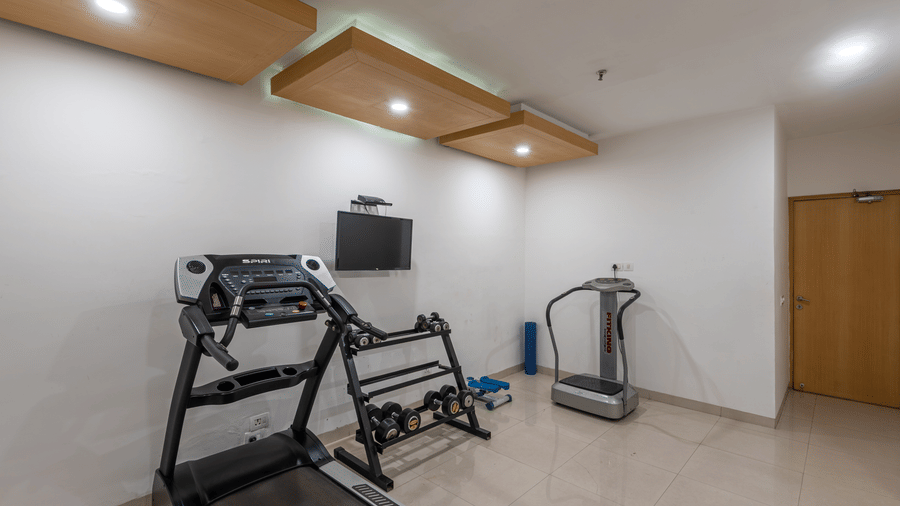 Modern gym room at Mango Grove designed for a complete indoor workout experience.