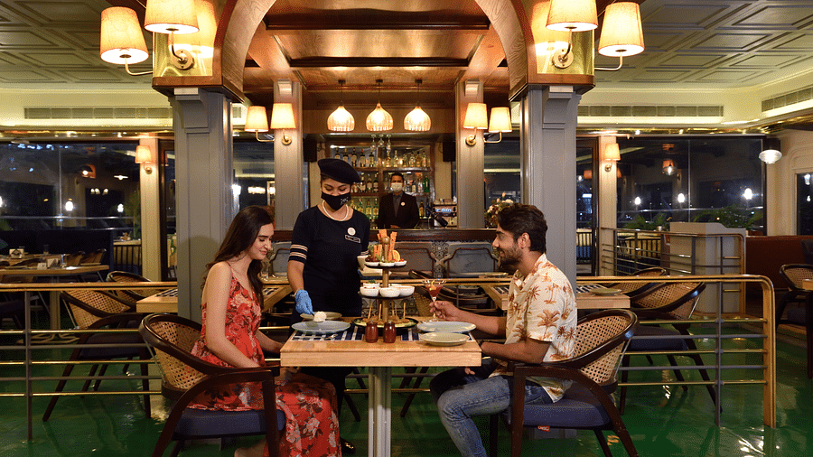 a couple ordering food at the dinning space 2 - polo floatel kolkata