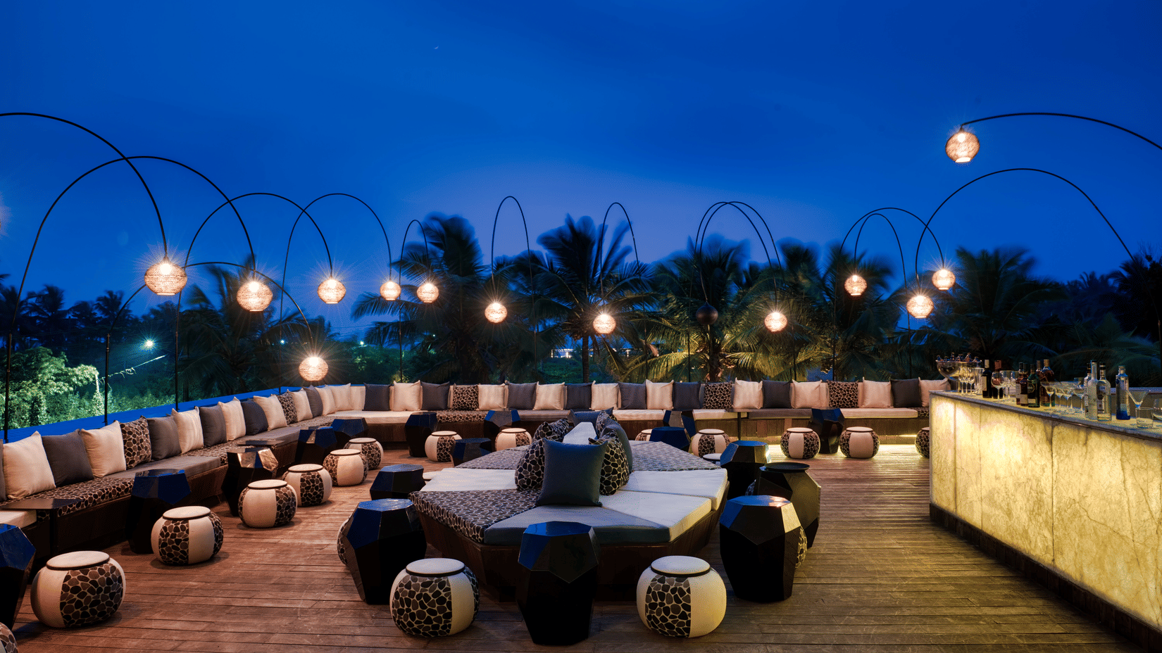 Seating area at Lynx Patio with the late evening sky in the background, restaurant in south Goa - Azaya Beach Resort Goa