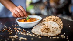 chef garnishing a dish