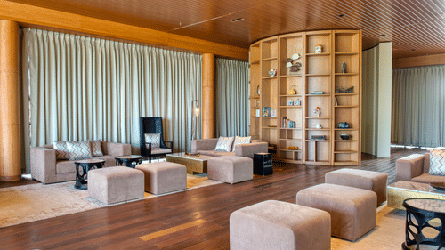 Bookshelf With Couches Azaya Beach Resort Goa 3