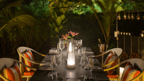 A table for 4 guests in an outdoor setting of La Concha set for a cosy intimate diner at Azaya Beach Resort, Goa.