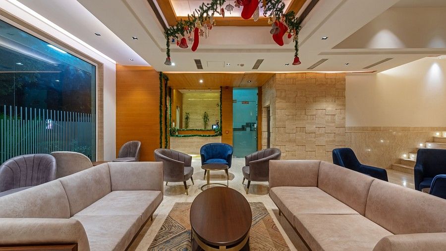 Hotel lounge with seating, warm lighting, carpet and Christmas decor at Hotel Saket, New Delhi 27, New Delhi