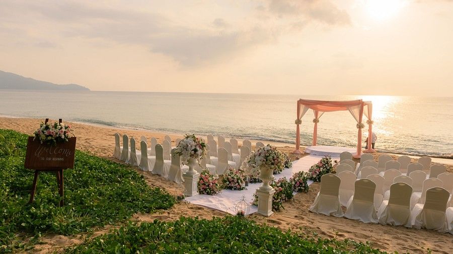 image of the wedding venue on the beach overlooking the ocean with a beautiful sunset in the background - Maikhao Dream Villa Resort & Spa, Phuket