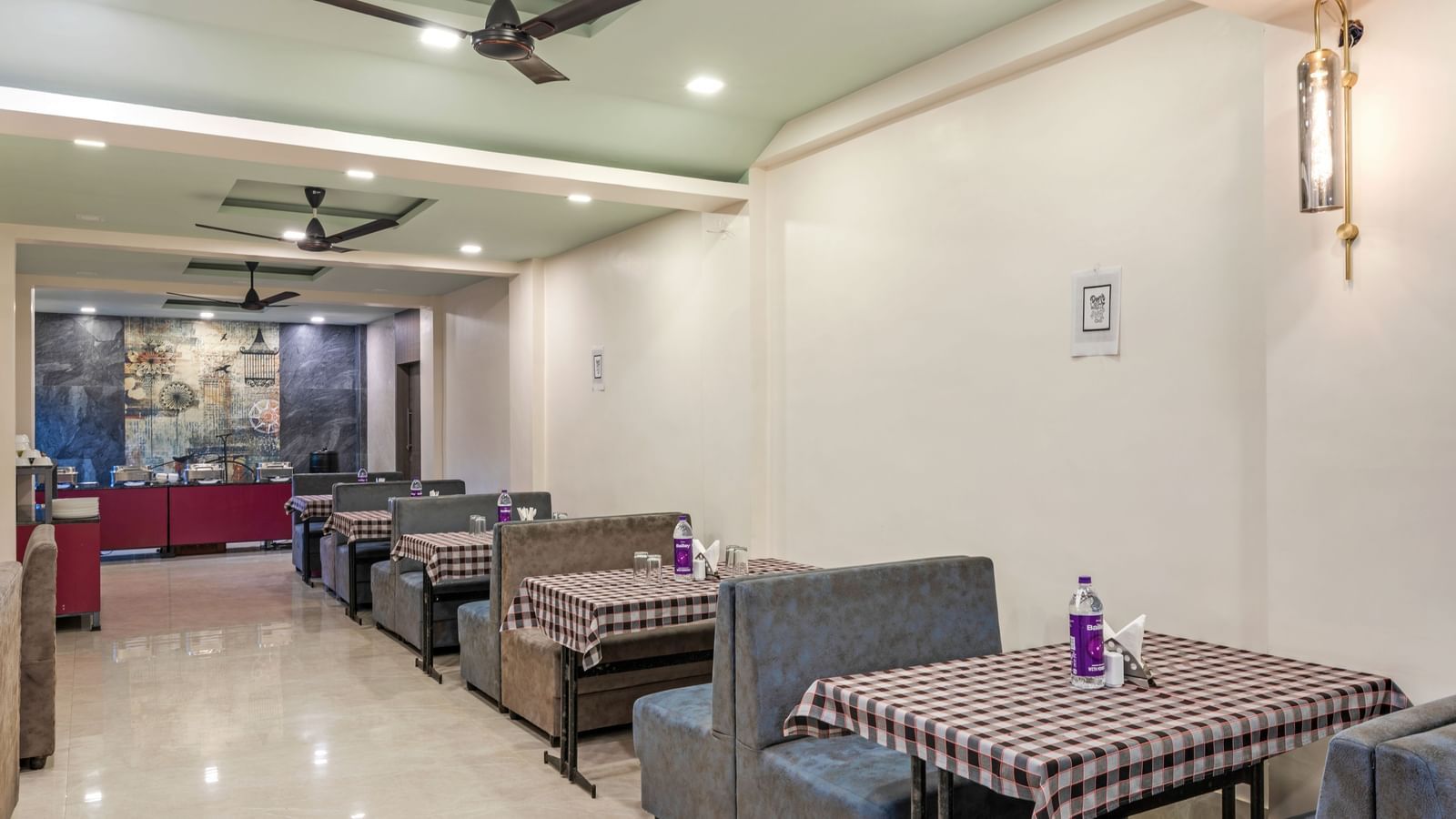 Indoor dining area with neatly arranged tables at Emerald Retreat, Tungarli.
