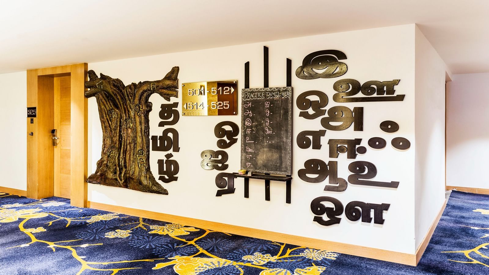 Wall with paintings displayed at Grand Chennai By GRT Hotels.