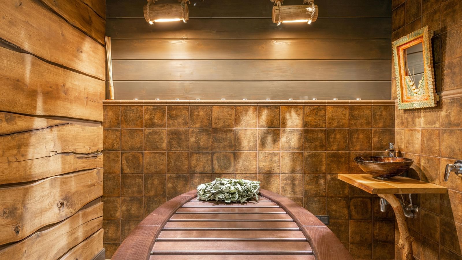 A spa room with wooden interiors showcasing a spa table, side table, and a photo frame.