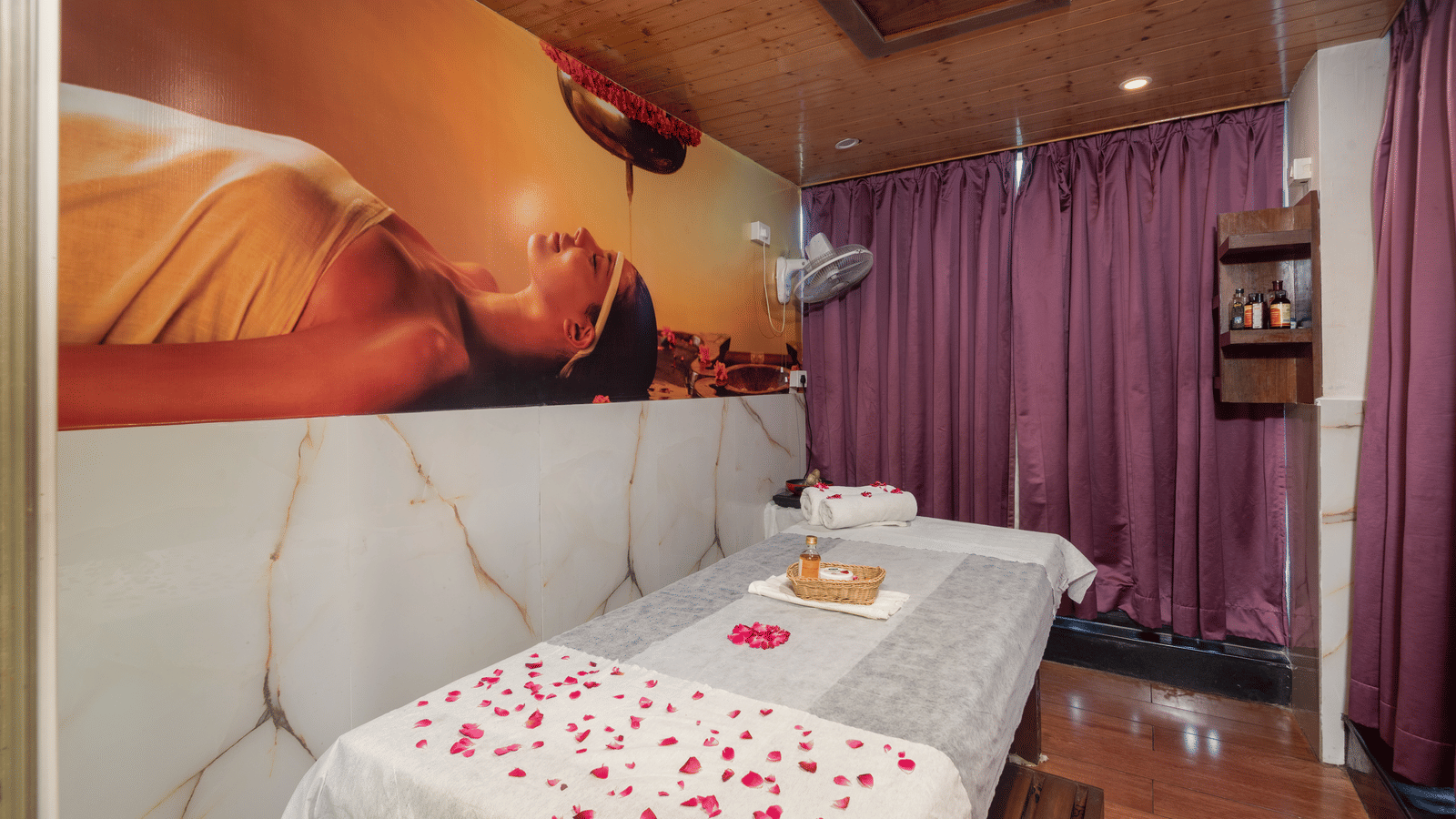 Spa treatment bed with fresh flowers at DLS Hotels On The Ganges.