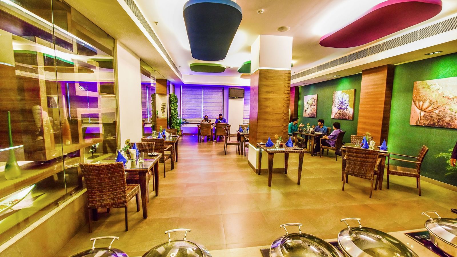 Image of Galleria with seating area and buffet table in front at Swosti Grand, Bhubaneswar