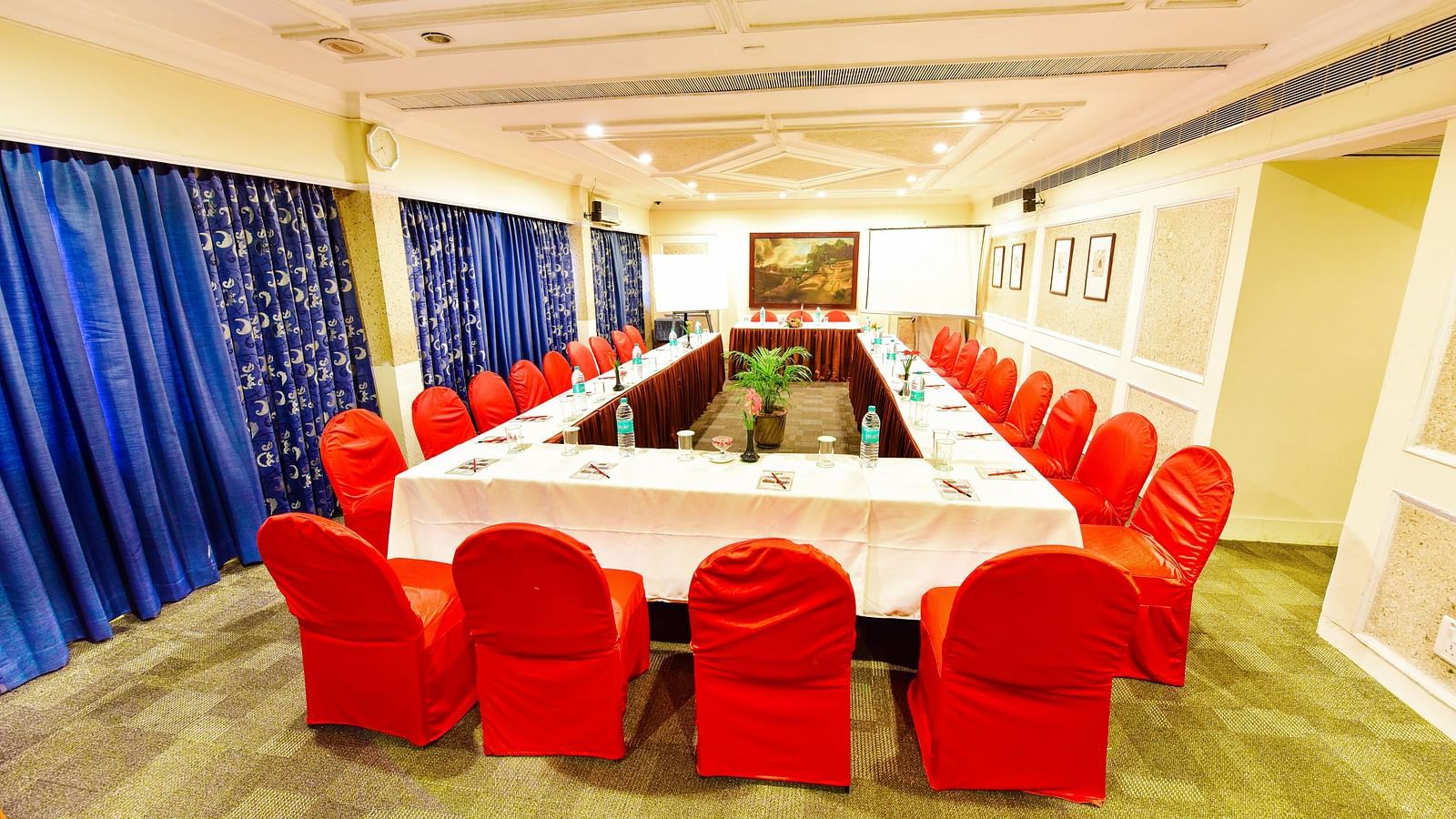 Image of mini banquet hall with table an chairs at Swosti Grand, Bhubaneswar