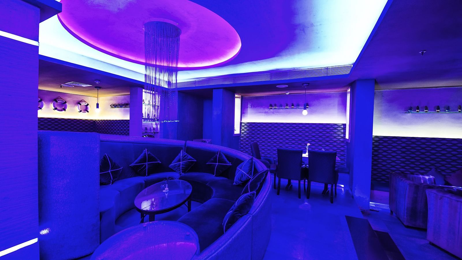 Image of Oceana bar with dim lighting and seating area at Swosti Grand, Bhubaneswar