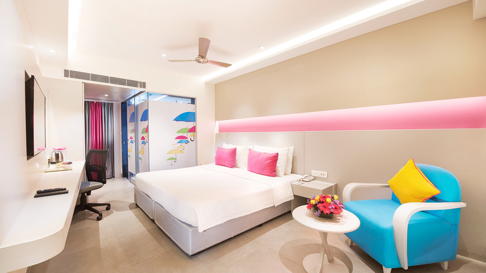 side view of a bedroom with a sofa at  Zibe Salem by GRT Hotels