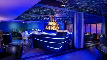 Image of a bar with seating arrangement at Grand Kakinada by GRT Hotels