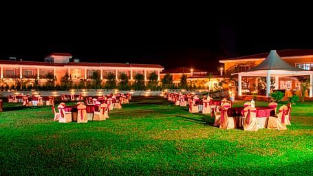 Seating arrangement in the lawn at Swosti Chilika Resort at night