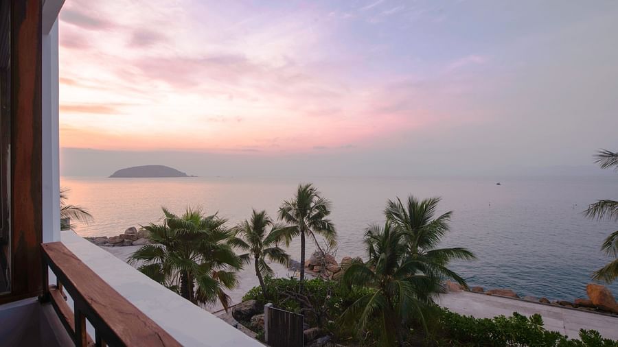 Another view of palm trees near a sea seen during a sunset through our balcony - Alibu Resort Nha Trang