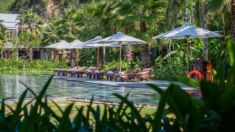 A pool at our resort with parasol by the pool - Alibu Resort Nha Trang