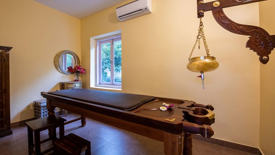 An image of a room with ayurvedic treatment in a spa at BluSalzz Resort.