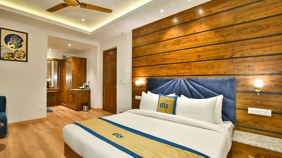 A large bed in front of the TV in Deluxe Non-view Room at DLS Ark Holiday Inn, Banikhet.