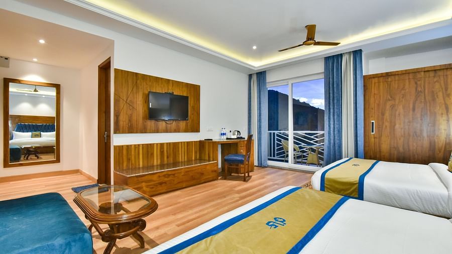 View from two large beds in front of TV in Family Suite Room at DLS Ark Holiday Inn, Banikhet.