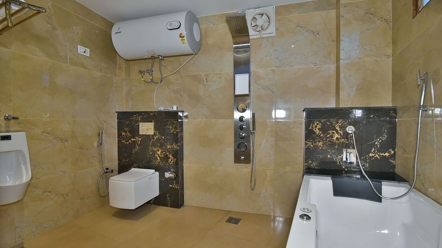 Luxury Room Washroom at DLS Dalhousie Valley Resort featuring a Jacuzzi, sink area and a toilet.