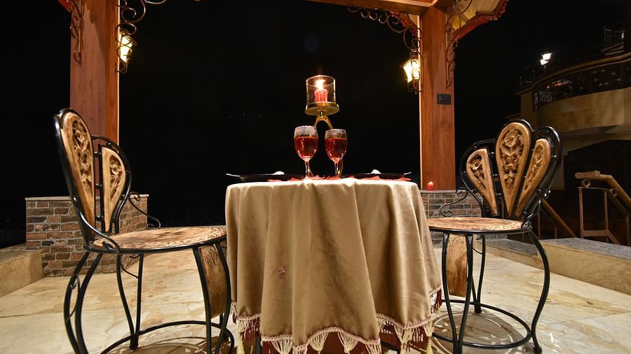 A Gazebo at DLS Dalhousie Valley Resort with beautiful chairs, table and wine glasses. 