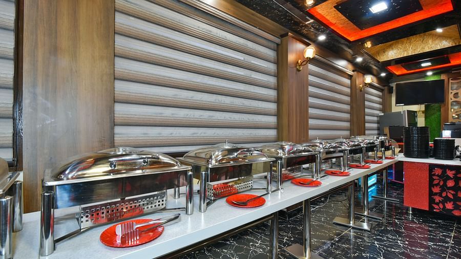 Buffet counter at DLS Dalhousie Valley Resort with various dishes kept on the table.