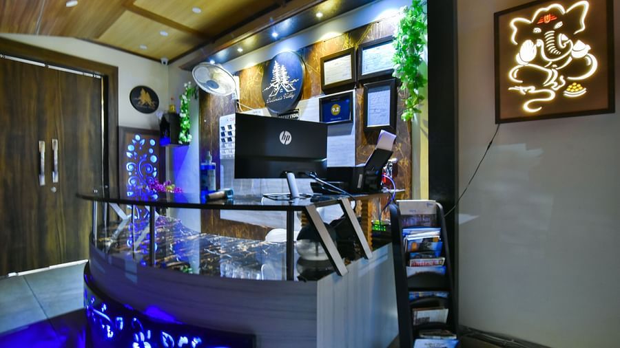 Reception at DLS Dalhousie Valley Resort featuring  front desk and a computer screen.