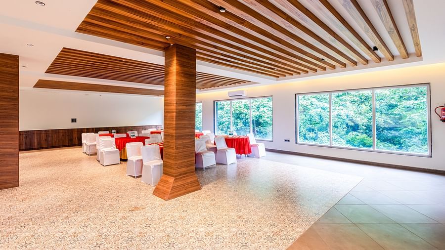 Banquet Hall at DLS Divine River Resort and Spa featuring  chairs table and a stage