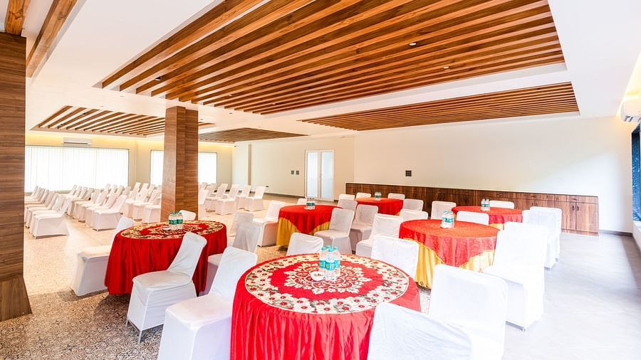 Banquet Hall at DLS Divine River Resort and Spa featuring  chairs table arranged in cluster setting.