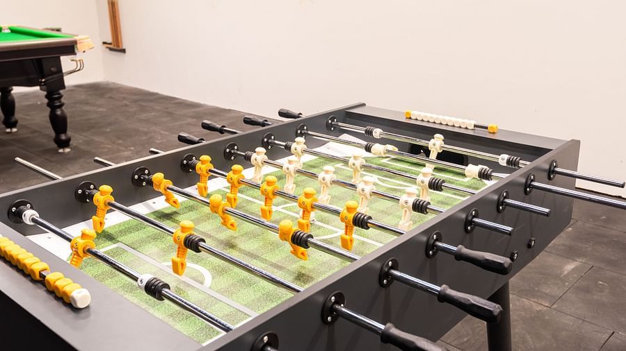 Indoor gaming area at DLS Divine River Resort and Spa featuring a foosball table.