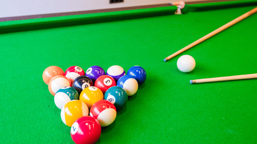 Indoor gaming area at DLS Divine River Resort and Spa featuring a pool table. 