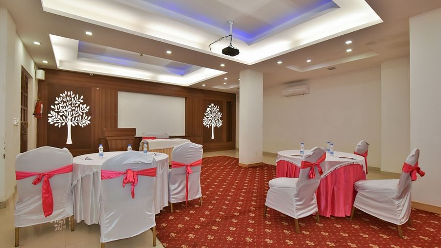 A conference hall with comfortable chairs facing the podium at DLS Highland Resort and Spa, Mussoorie.