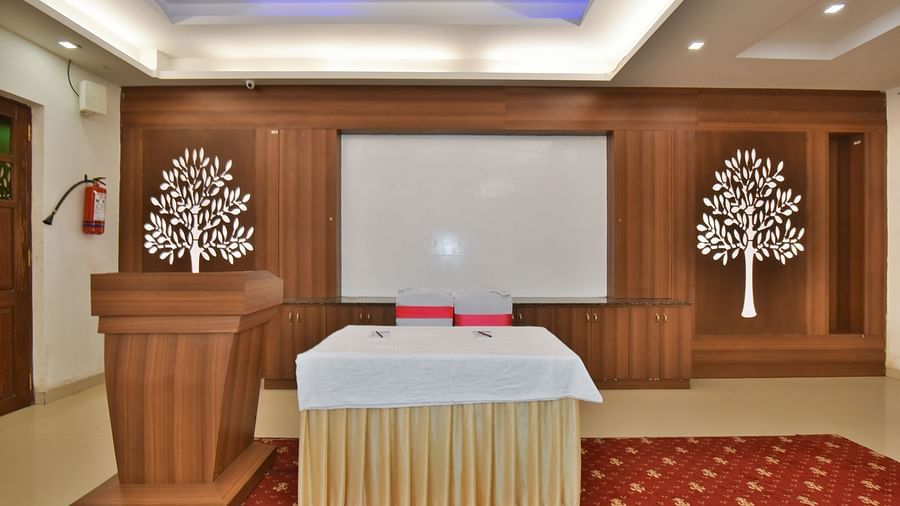 A podium next to a table at Conference Hall at DLS Highland Resort and Spa, Mussoorie.