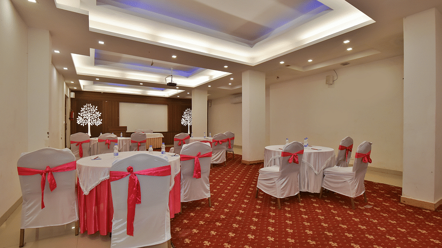A conference hall with comfortable chairs facing the podium at DLS Highland Resort and Spa, Mussoorie.