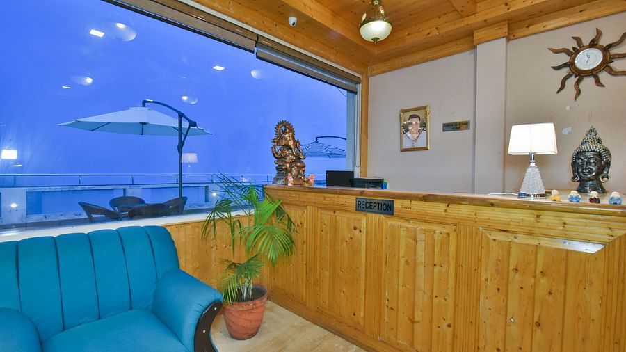 Reception desk near the sofa in the lobby at DLS Highland Resort and Spa, Mussoorie.