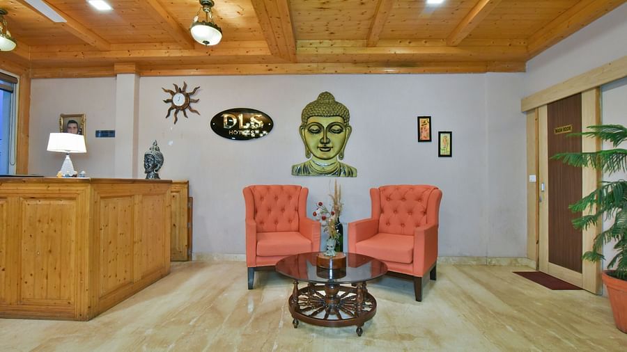 Two comfortable sofas near the reception desk at DLS Highland Resort and Spa, Mussoorie.