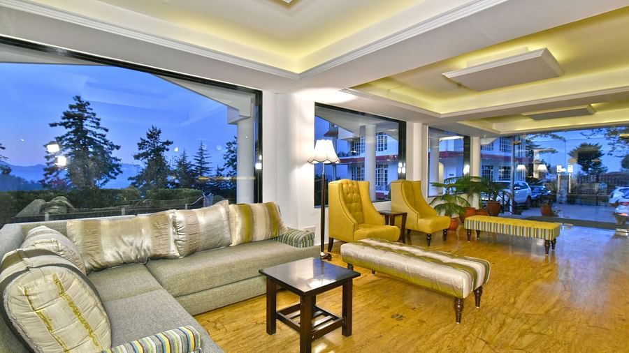 Lobby area with sofas at DLS Hillcrest Resort, Shimla.