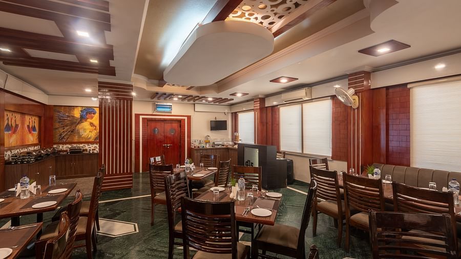 Dining area with chairs and tables at DLS Park Grace, Haridwar.
