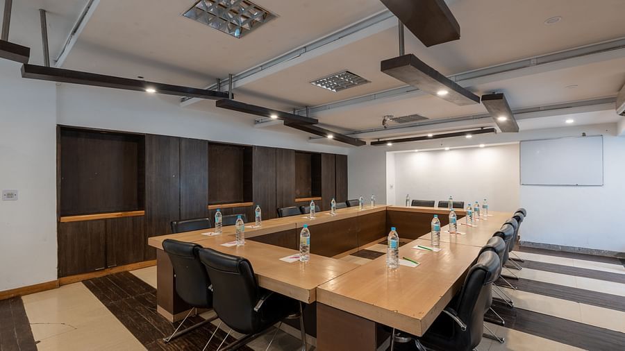 Overview of Conference Hall  at DLS Spring Valley Resort Dharamshala  with chairs and tables arranged in boardroom setting 