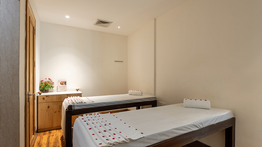 side view of spa beds decorated with rose petals at DLS The Classio