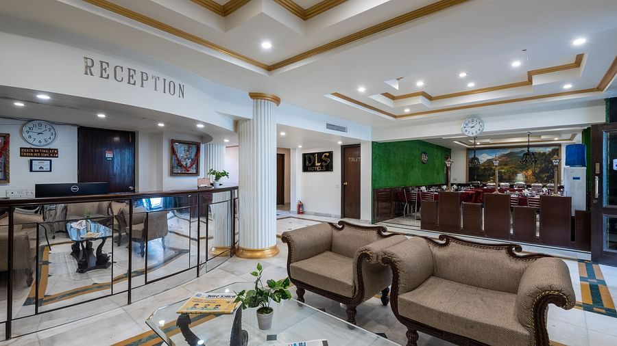 Image of the reception area at the hotel featuring some couches and a front desk  | DLS The Pearl