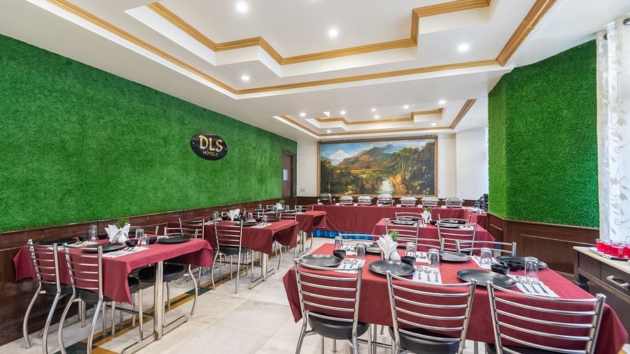 Shot of the restaurant with dining tables and chair | DLS The Pearl