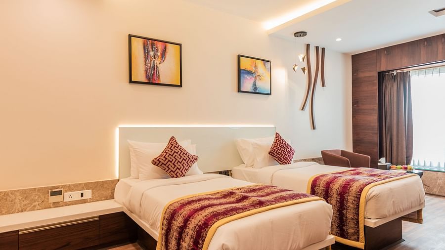 Premium Room at Hotel Park Elanza, Coimbatore featuring twin beds overlooking a window